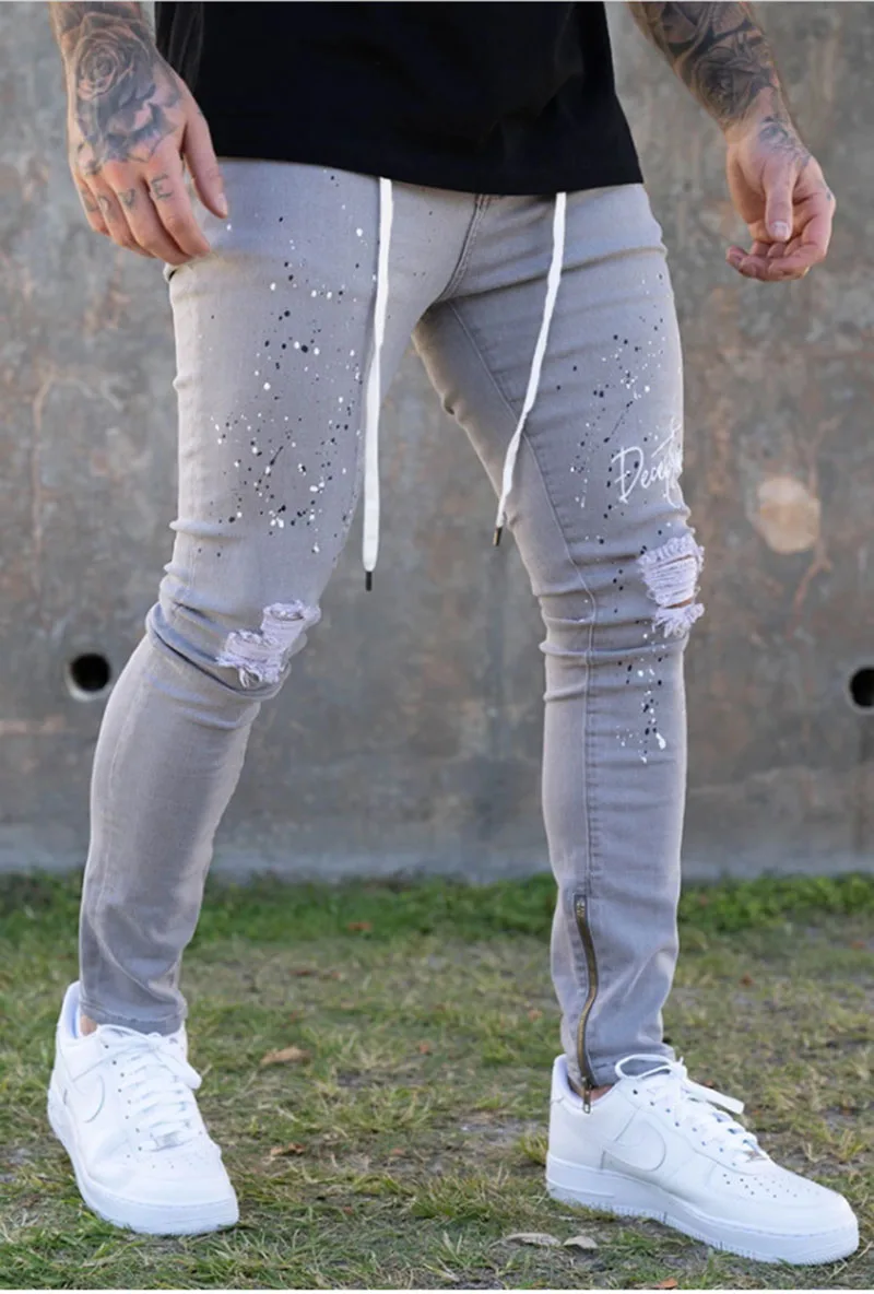 

New men's white slim-fitting ripped feet pants European stand paint tether jeans men