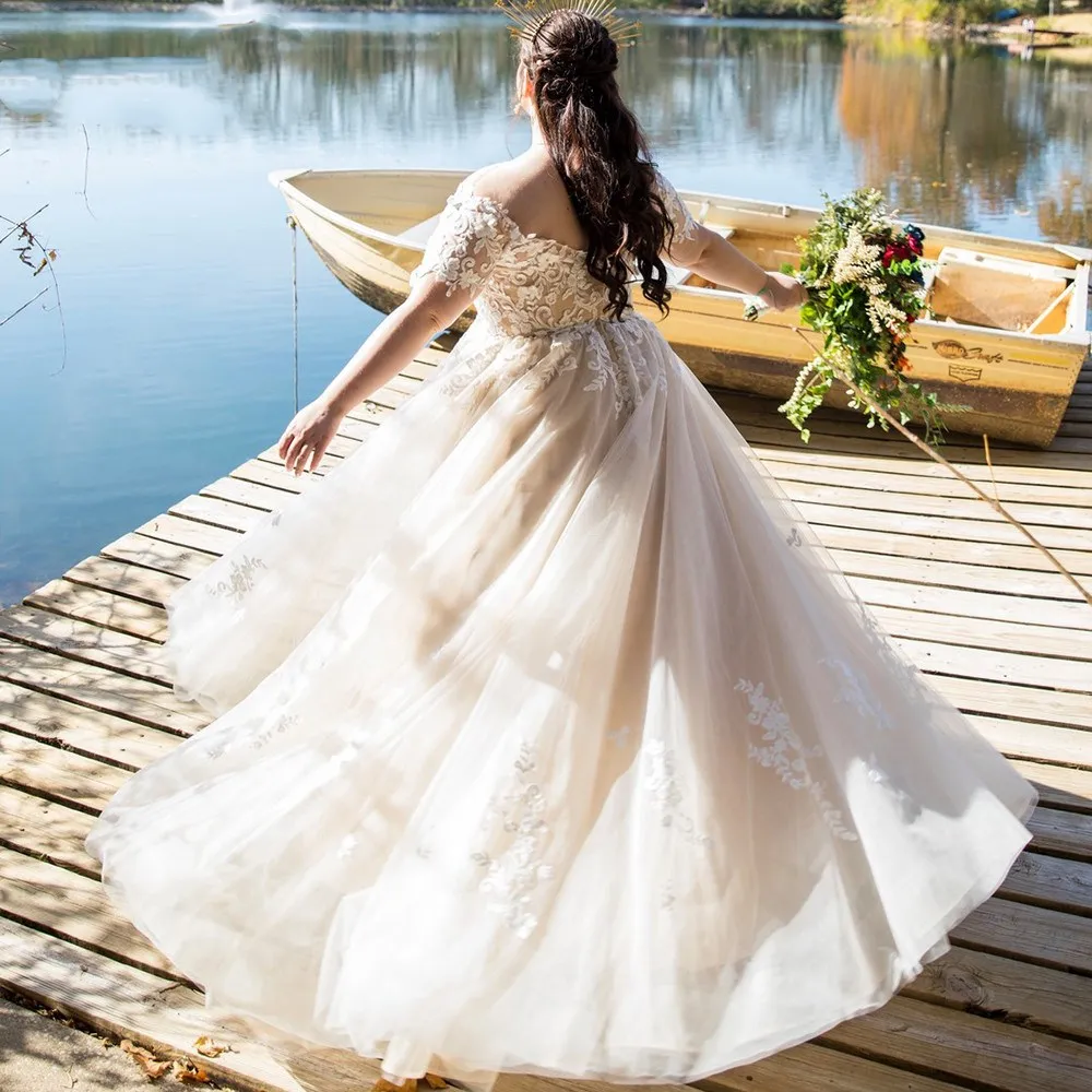 

Plus Size Wedding Dresses Short Sleeve Off Shoulder Crystals Pearls Sash Applique Lace A Line Bridal Gown Vestido De Novia