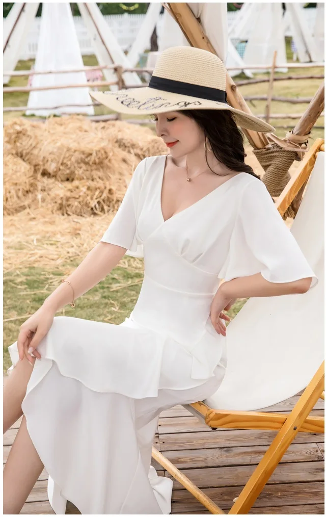 

New women's seaside vacation hedging V-neck sexy backless beach dress with waist stitching and ruffled white dress