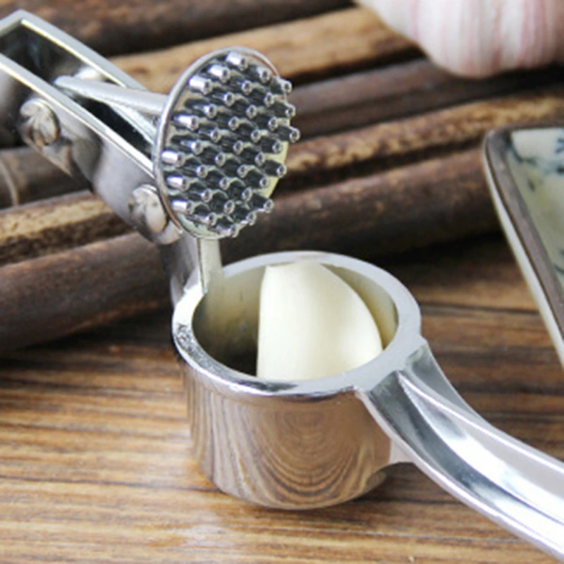 

Garlic Press Mill Multi-function Manual Garlic Mud Maker Peeled Garlic Garlic Clip Tool Stainless Steel