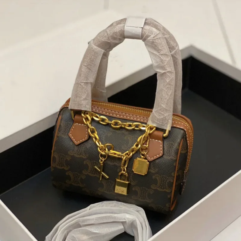 

New fashion triumphal arch old flower pillow bag retro straddle portable leather women's bag Classic women's shoulder bag