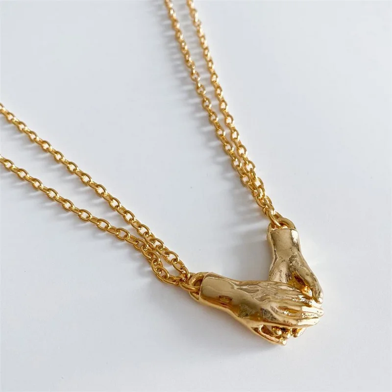 

2pcs/set Romantic Magent Hand in Hand Necklace Stainless Steel Necklaces Pendant Choker Couple Jewelry Gift