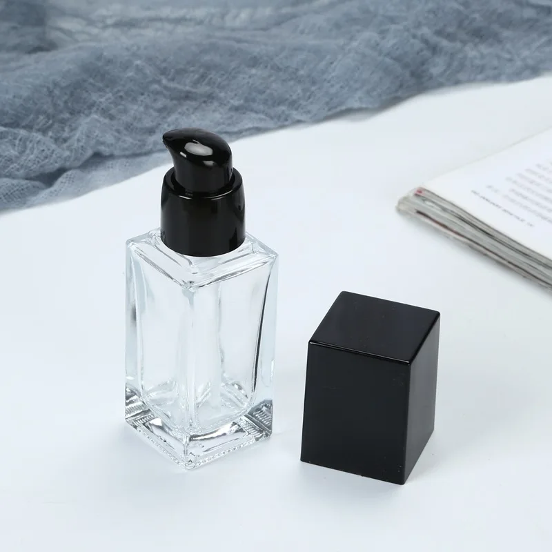 

Пустая прозрачная квадратная стеклянная эмульсионная бутылка 30 мл/1 унция с черной помпой, дорожные контейнеры для основы под макияж, лосьо...
