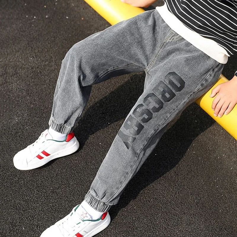 

Spring & Autumn Boy Jeans New 2021 Korean Version Fashion Handsome Slim Elastic Waist Tight Cuffs Letter Casual Children's Pants