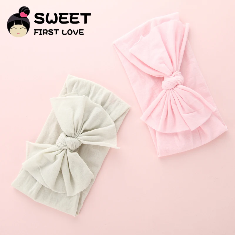 Повязка на голову женская с большим бантом нейлоновая мягкая эластичная лента