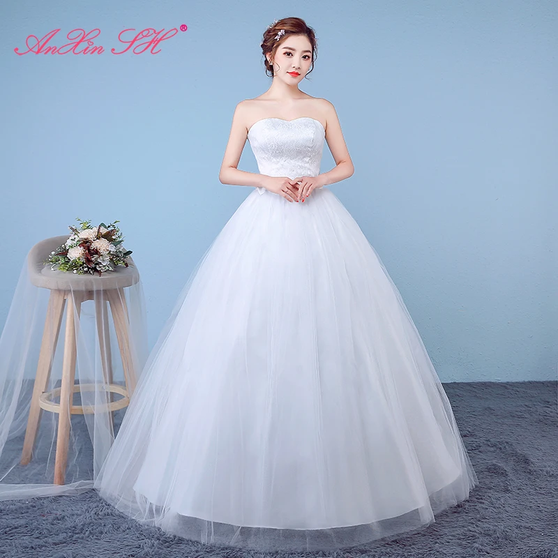 

AnXin SH princess white flower lace party vintage strapless sleeveless bow sparkly turkey illusion ball gown wedding dress