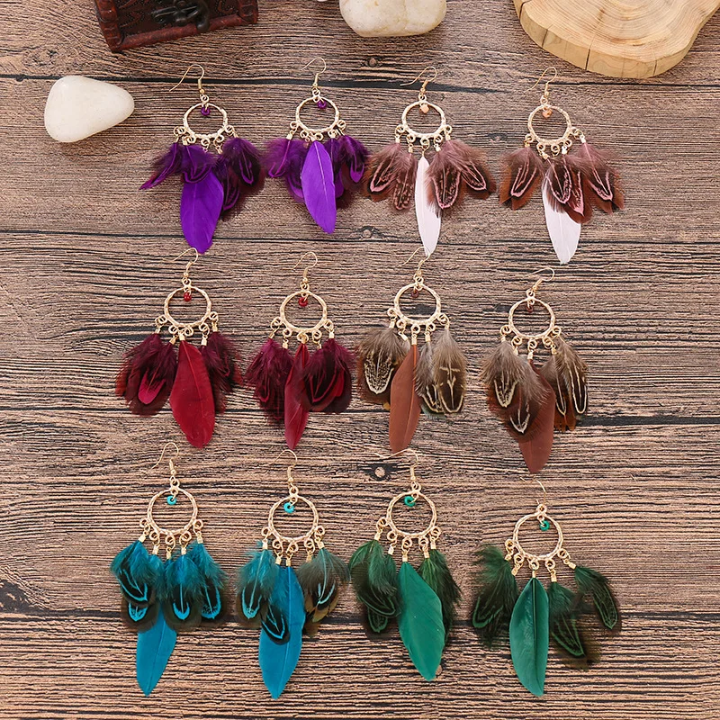 

Bohemian new round pearl Feather Earrings long European and American simple women's feather earrings wholesale
