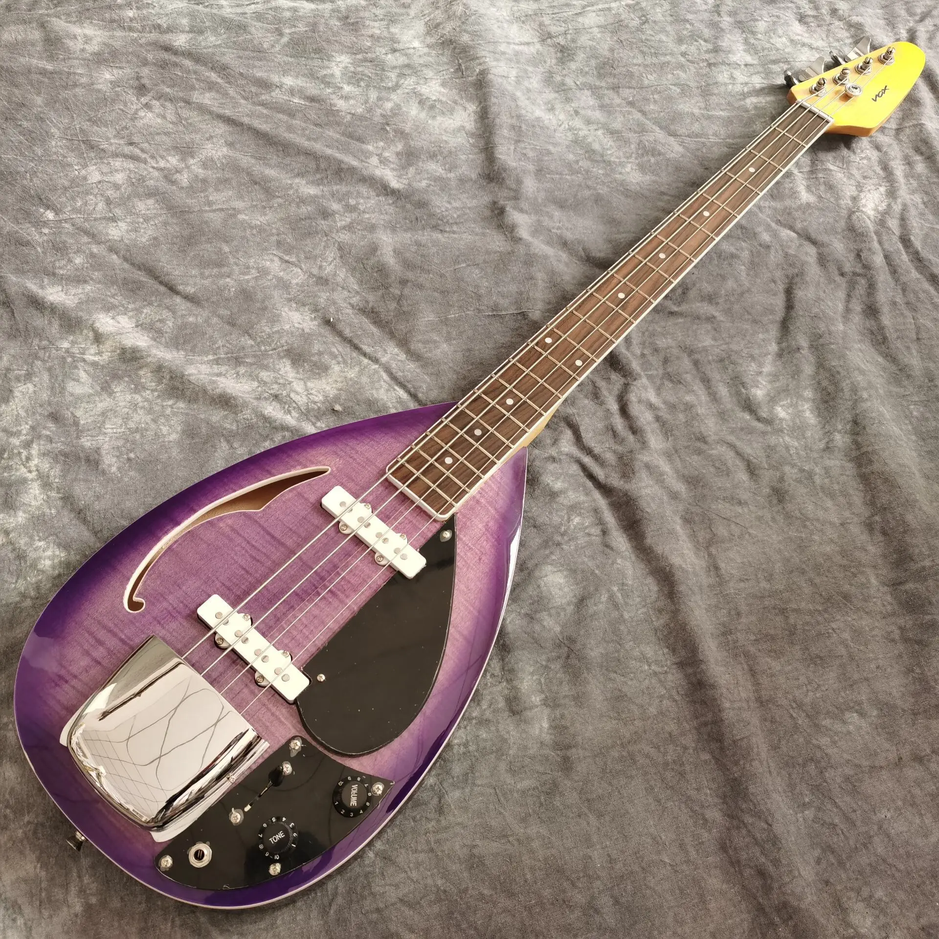 

Purple color tiger flame top electric bass guitar.high quality pickups.handmade 4 stings bass guitarra.real photos