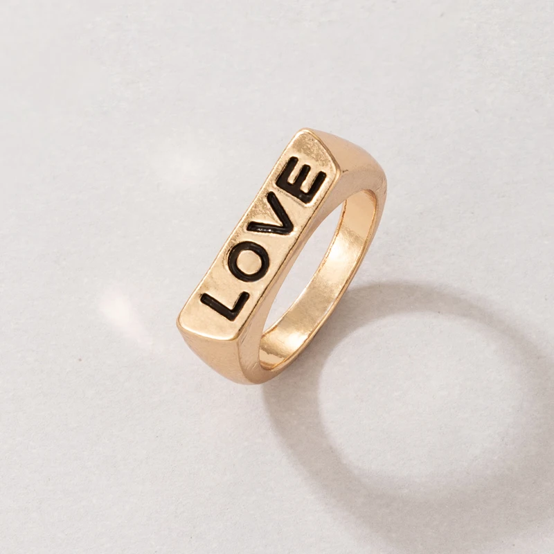 Женское кольцо с бантом и змеей в виде сердца