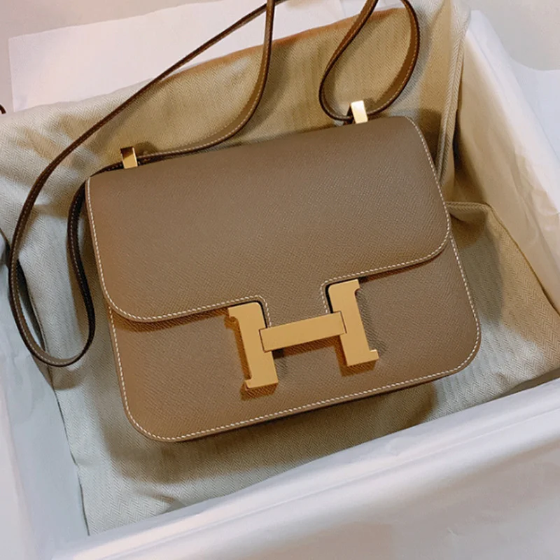 

Leather women's bag h-button Kangkang Bag Fashion messenger bag portable one shoulder small square bag cowhide box bean curd bag