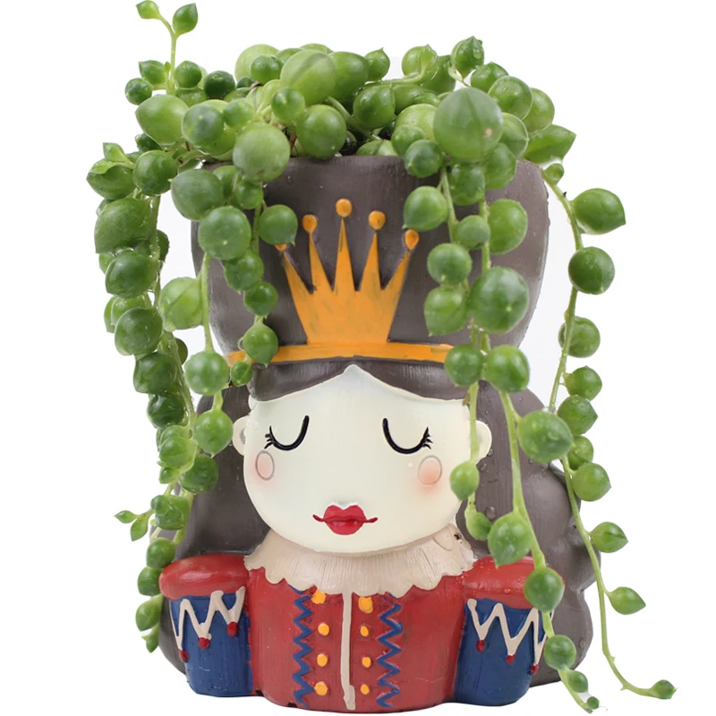 Цветочные горшки с абстрактным персонажем из мультфильма в горшках