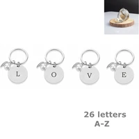 26 letter stainless steel keychain simple letter simulation pearl wings metal keychain pendant jewelry accessories