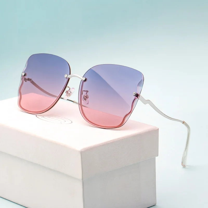 

New Sunglasses Ladies Fashion Frameless Diamond Inlaid Nylon Sunglasses Female Fashion Butterfly Sunglasses Wholesale 6170