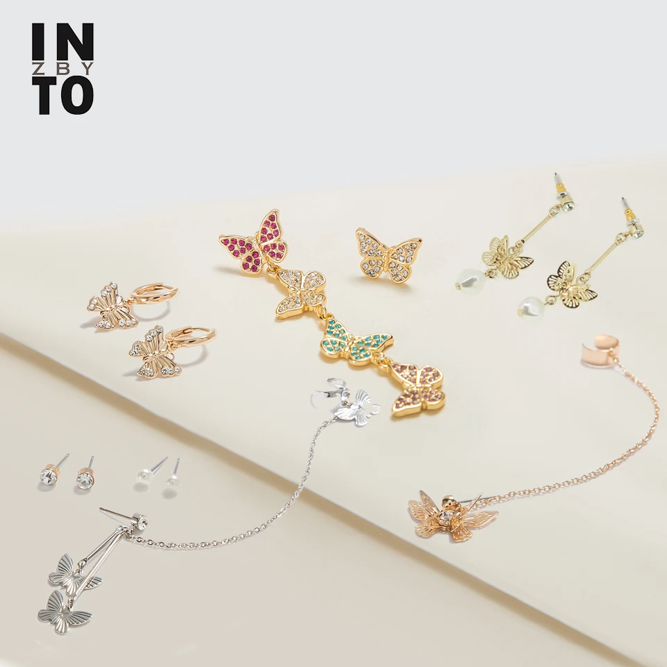 Женские серьги подвески Into Trendy асимметричные с жемчугом и кристаллами модные