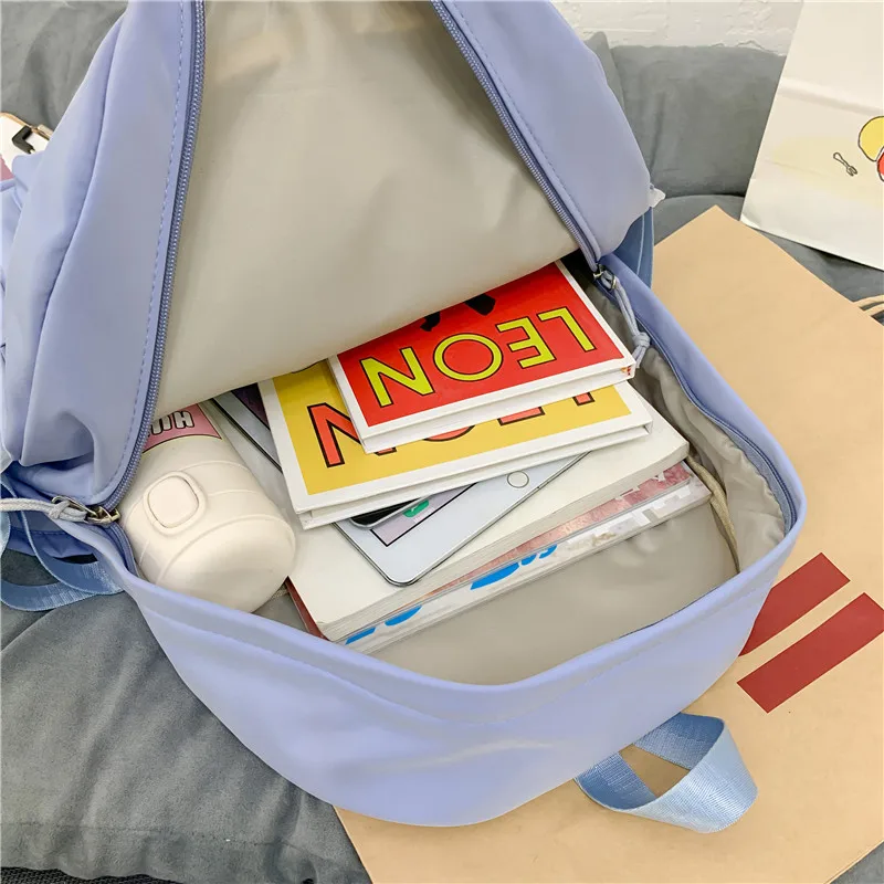 

2021 New Waterproof Nylon Women Backpack Female Cartoon Print Transparent Pocket Book Bag Teenage Girls Double Layer Schoolbag