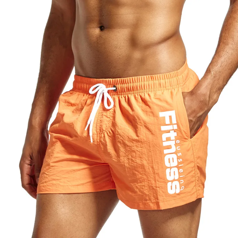 Шорты с подкладкой. Оранжевые шорты мужские. Купальные шорты мужские оранжевые. Шорты пляжные в сеточку. Спортивные шорты мужские для фитнеса.