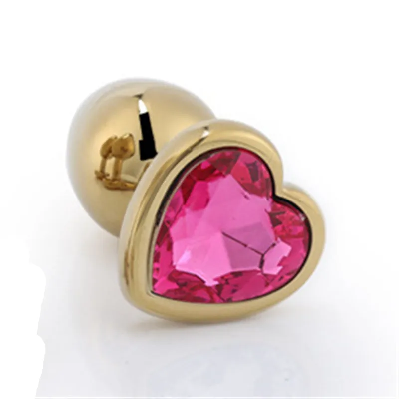 Анальная пробка золотого цвета в форме сердца металлическая с драгоценным