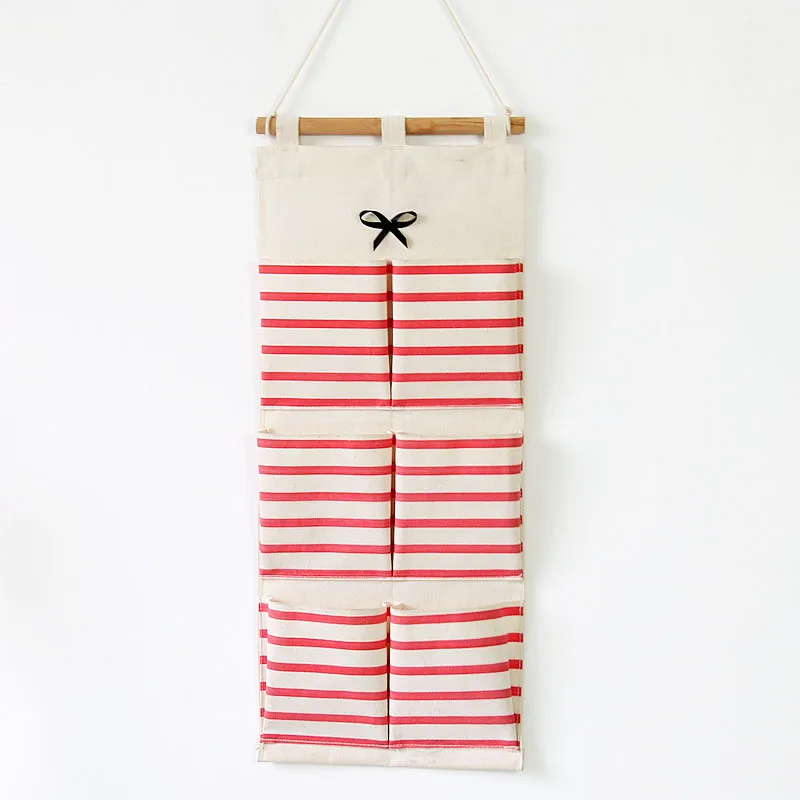 

Fashion linen striped bowknot 6 pockets home closet hanging bag for sundries makeup organizer solid color storage bag wall decor