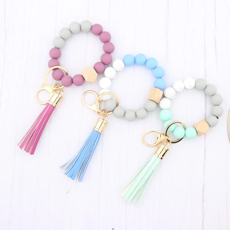 

Wooden Silicone Beaded Bangle Bracelets Keychains Leather Tassel Key Rings Women Bag Accessories