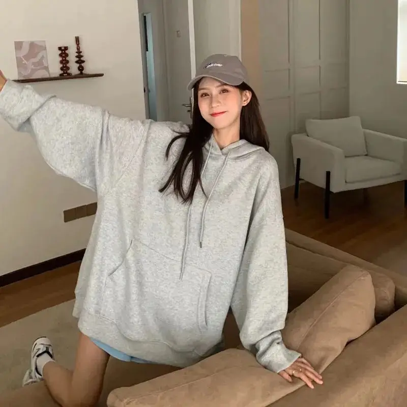 

Autumn and winter 2021 new solid color hooded sweater women's trend wild long-sleeved Korean loose coat trend