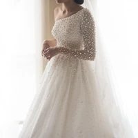 one shoulder long sleeves heavy crystals pearls bling bling wedding dress luxurious beading iovry bridal gowns