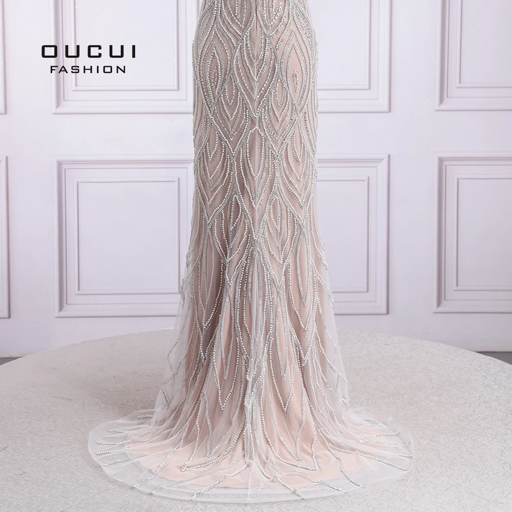 

Oucui Luxury Mermaid Long Evening Dresses 2020 Dubai Sexy Nude White Sleeveless Pearls Formal Gowns Robe De Soiree OL103637