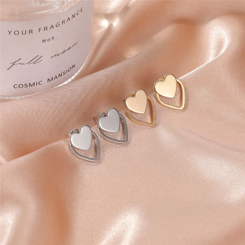 

HAIMAITONG Modyle New Gold Silver Color Heart Earrings For Women Punk Vintage Hollow Stud Earrings Fashion Jewelry Gift