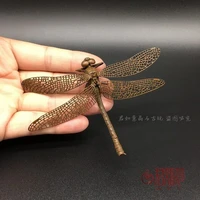 delicate and lovely dragonfly make old bronze figurines imitating antique
