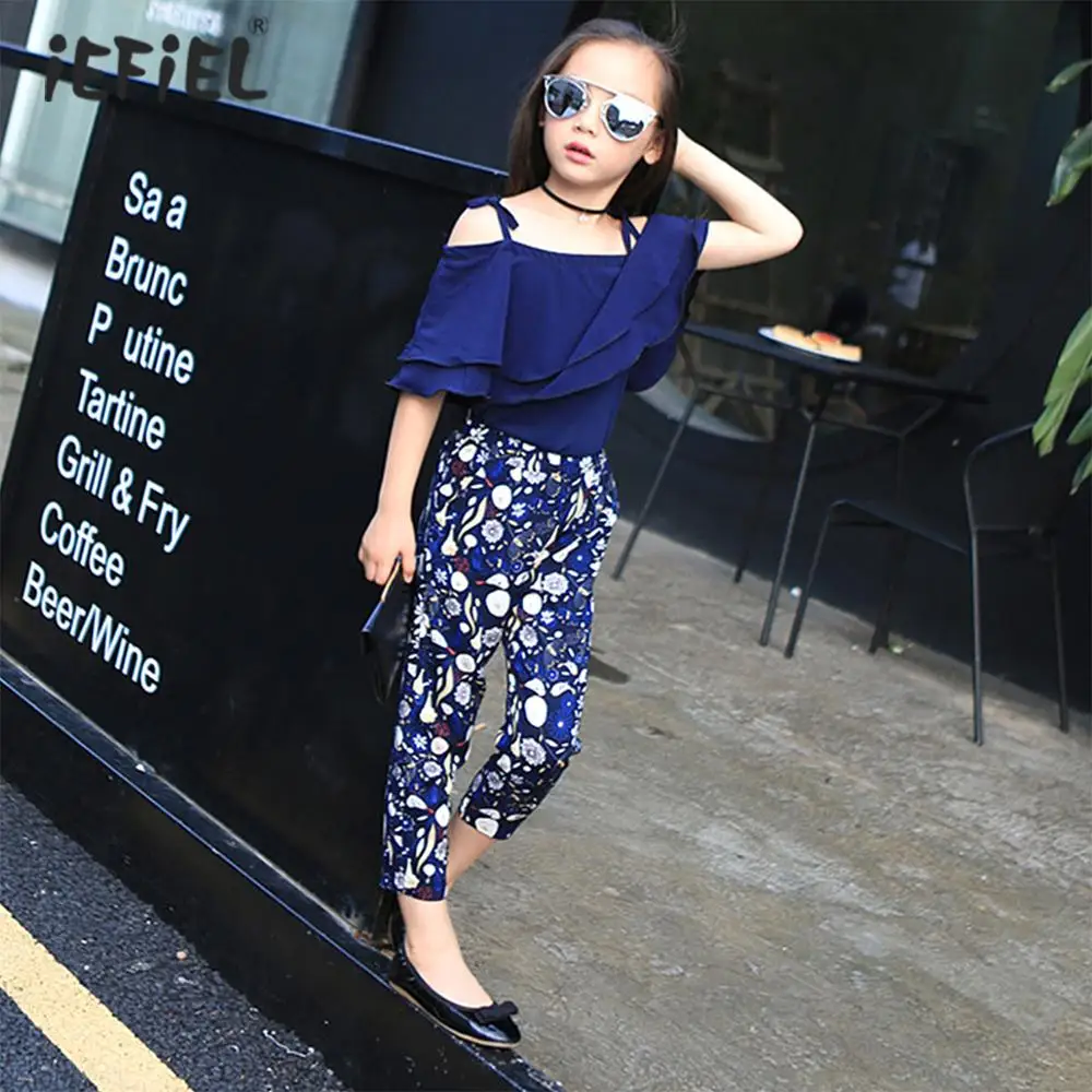 

Детская шифоновая одежда для девочек, топ с открытыми плечами и коротким рукавом с оборками, винтажные укороченные брюки с цветочным узором...