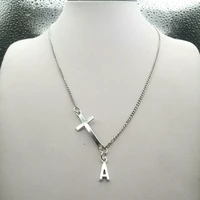 sideways cross necklace with initial charm script initial necklace religious jewelry