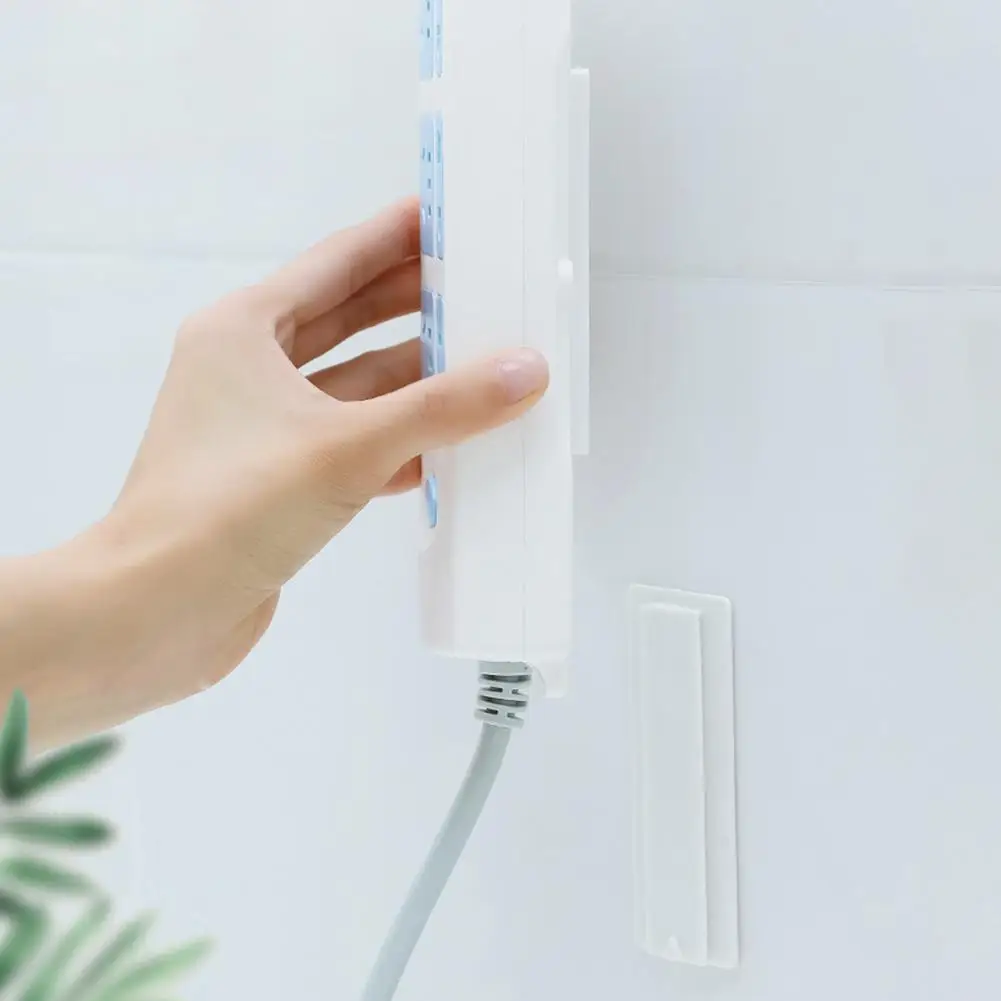 

Seamless Punch-free Plug Sticker Holder Wall-Mount Power Strip Holder Seamless Sticker Self-Adhesive Home Plug Rack