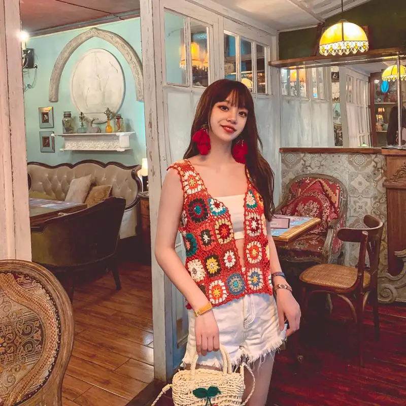 

Original video scene shooting Bohemia wear by manual homemade hollow out cardigan outside by color national wind vest