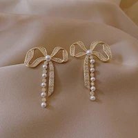 metallic material bowknot shape pearl tassel earrings female east door minority personality cold wind earrings