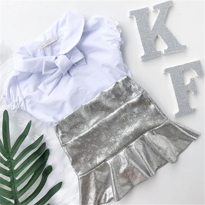 

Модная одежда для девочек, комплект из двух предметов, топ с рукавами-фонариками и бантом с лацканами и юбка из искусственной кожи для празд...