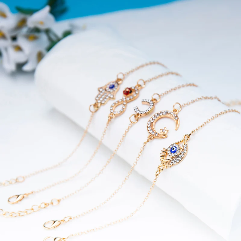 Женский браслет-цепочка с кристаллами подвеской глаз