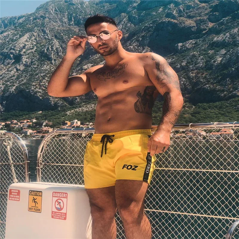 

Muscle fitness brothers men's sports and leisure shorts summer breathable and quick-drying seaside beach pants