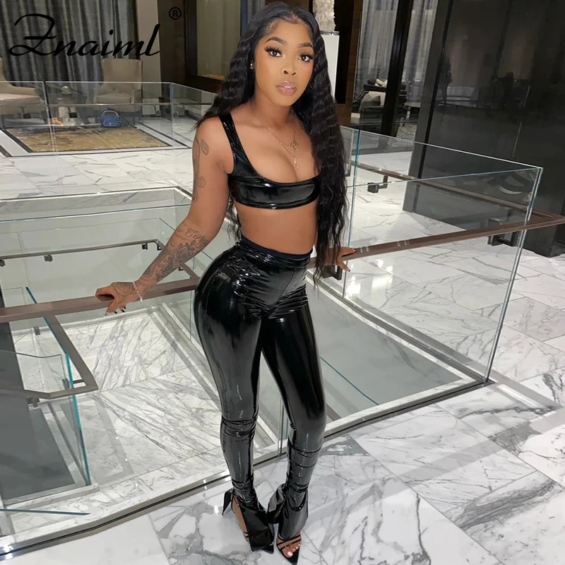 

Znaiml Women PU Faux Leather Sexy Two Piece Set Sleeveless Spaghetti Strap Crop Top And Flare Bottom Pants Club Party Outfit