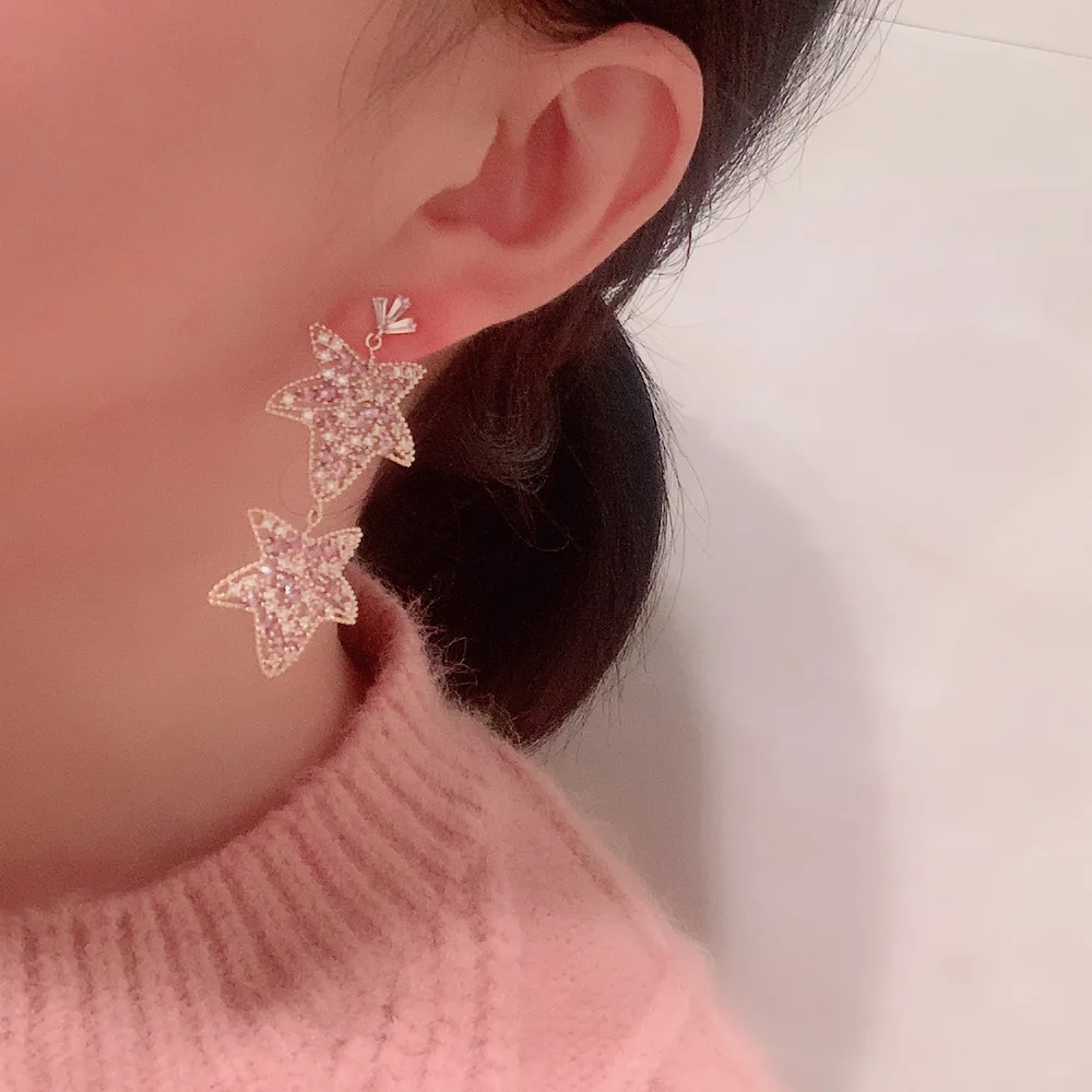 

Purple leaf earrings sweet temperament personality exaggerated silver needle hollow flower starfish tassel earrings