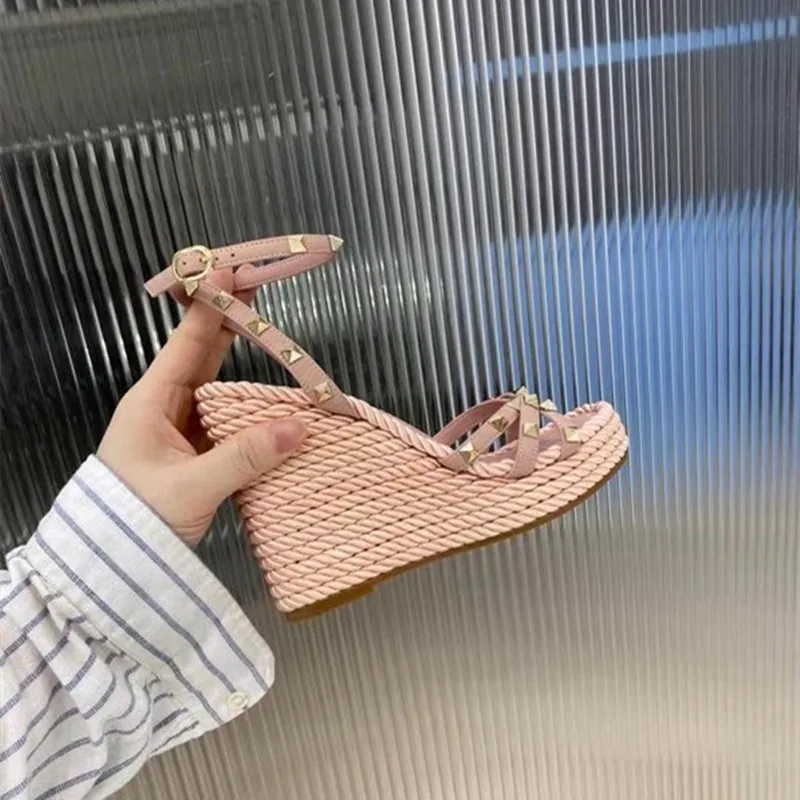 

2021 new rivet leather woven slope heel sandals women's Roman fairy style one line high heel waterproof platform women's shoes