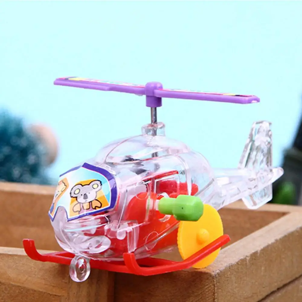 

1pcs Wind Up Toys Transparent Mini Aircraft Clockwork Wind Up Toys Kids Airplane Model Toy for Children Baby Birthday Gifts