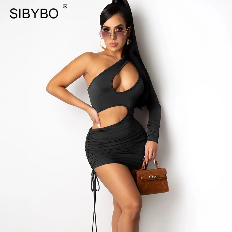 

Sibybo Hollow Out Sexy Women Dress Black One Shoulder Bodycon Mini Dresses Female Spring Drawstring Ruched Party Vestidos 2021