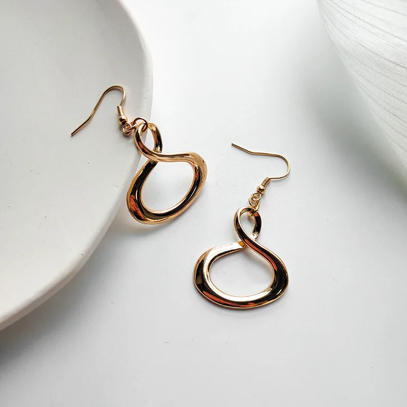 

European and American style retro temperament simple versatile exaggerated metal twisted geometric hollow earrings earrings earr