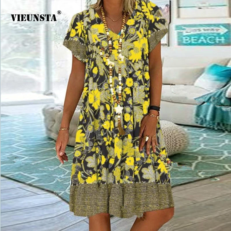 Женское платье средней длины с V-образным вырезом и коротким рукавом