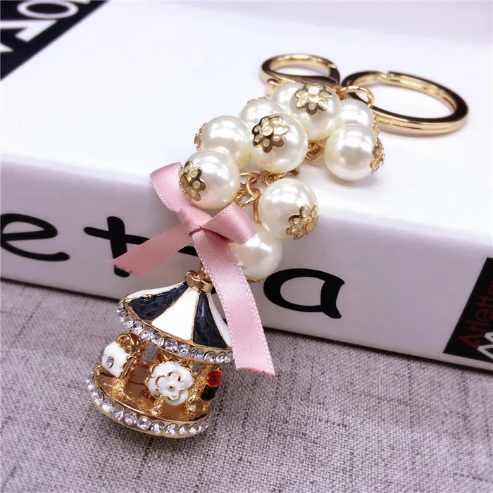 New Creative Fashion Carousel Key Chain Personality Trend Pearl Charm Key Chain Lady Cute Bag Mobile Phone Pendant Key Chain