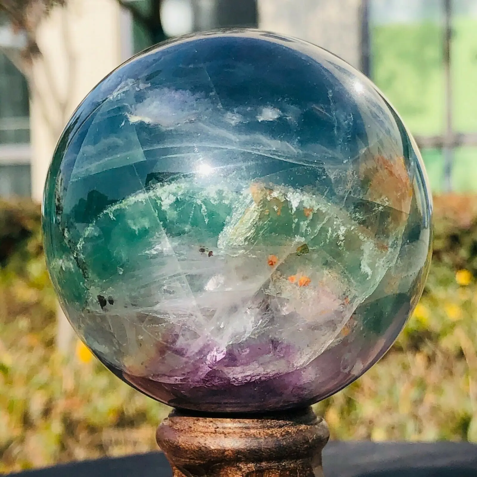 

Natural polished fluorite crystal energy orb reiki healing