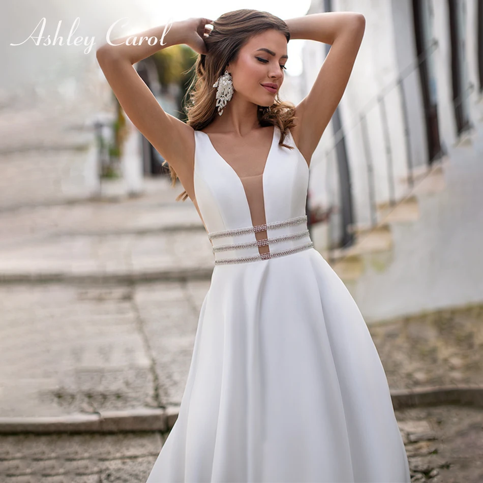

Свадебное атласное платье-трапеция Эшли Карол 2023 с глубоким v-образным вырезом и бисером без рукавов с поясом винтажное свадебное пляжное платье Vestidos De Novia
