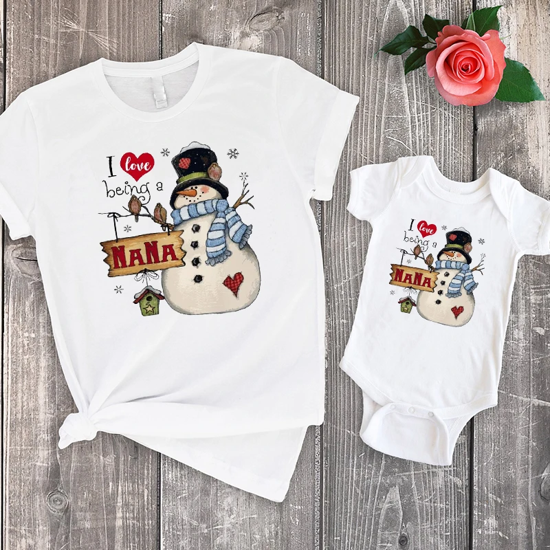

Snowman I Love Being A NANA Christmas Shirt Mom and Daughter Matching Clothes Cartoon Christmas Family T-Shirts