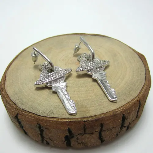

Silver Diamond Pure White Key Saturn Earrings