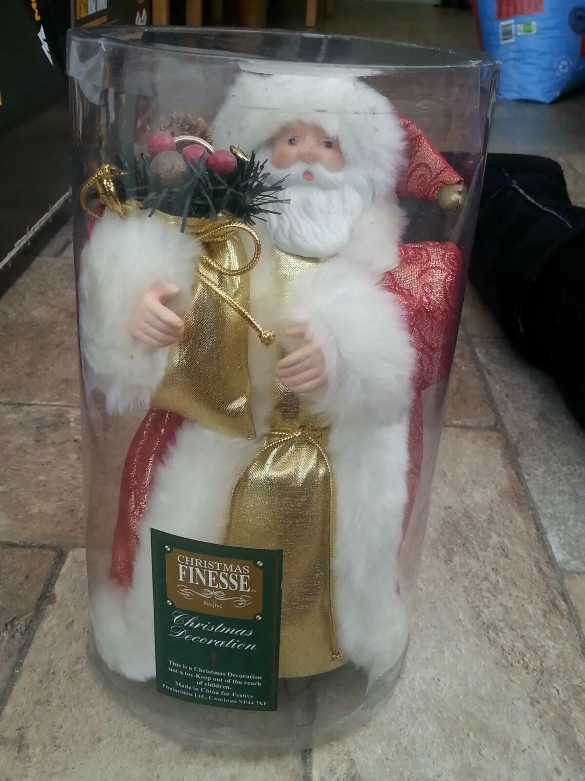 

Christmas decoration / ornament of Santa Claus with a ringing bell in hat 25cm