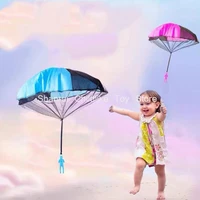 hand throwing parachute kids outdoor funny toys game play educational toys for children fly parachute sport mini soldier running